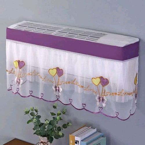 Purple Airify embroidered lace AC cover with ruffled trim on a split air conditioner indoor unit